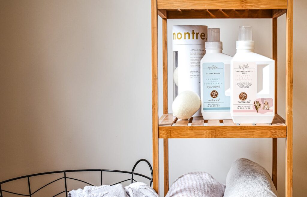 Towels and body care products arranged on bathroom shelves