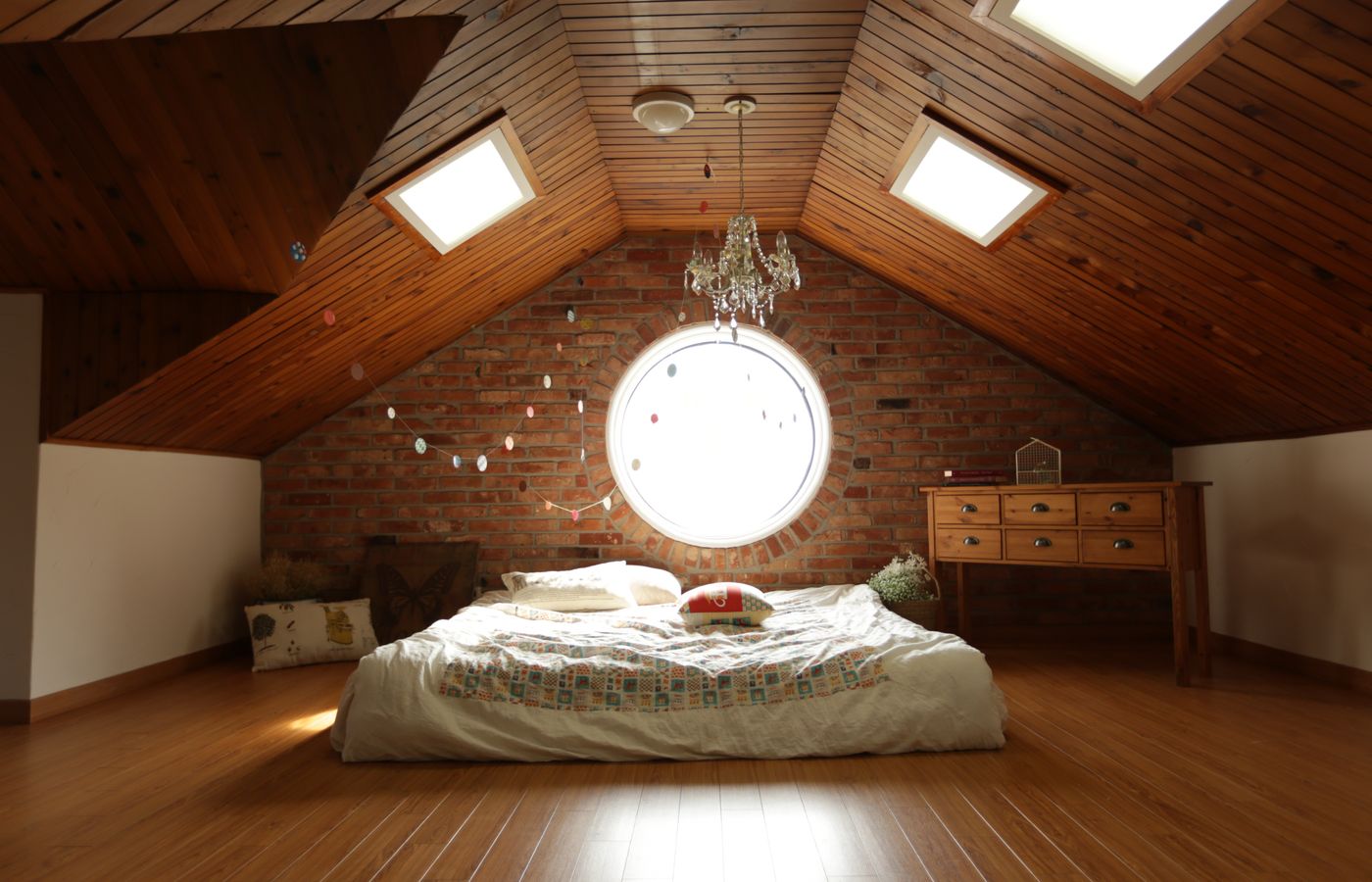 Small bedroom with a bed, nightstand, and soft neutral bedding
