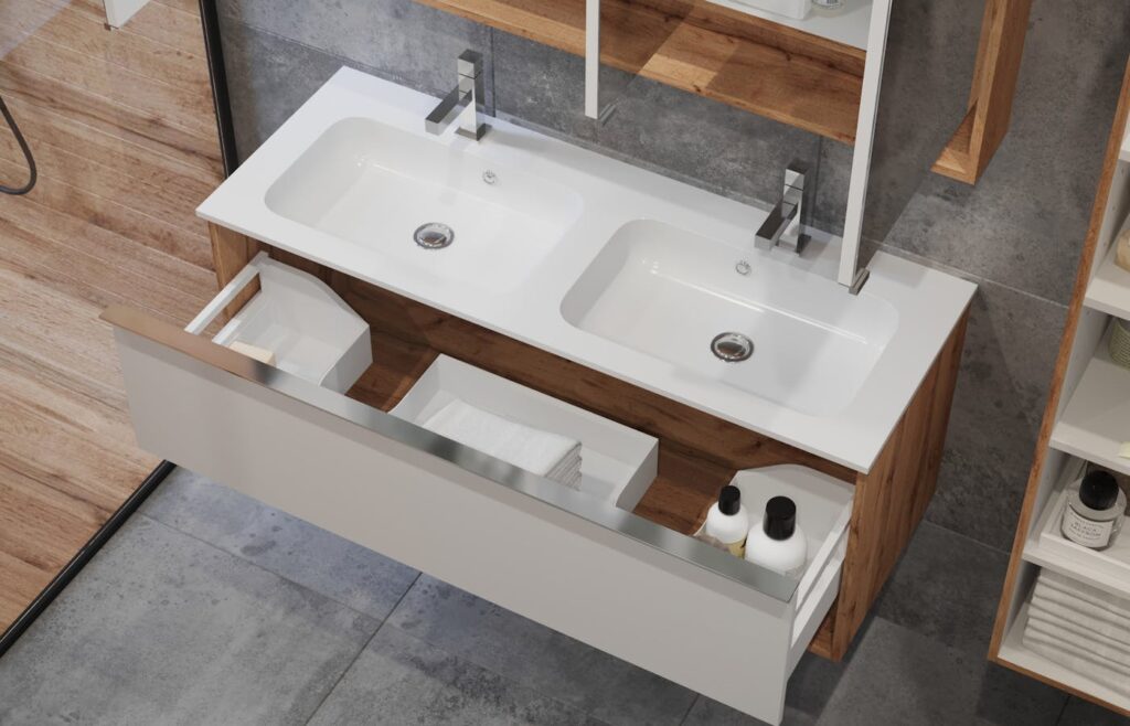 Clean bathroom vanity with open drawers and folded towels