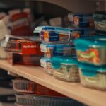 Plastic food storage containers stacked on a store shelf