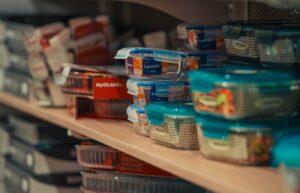 Plastic food storage containers stacked on a store shelf