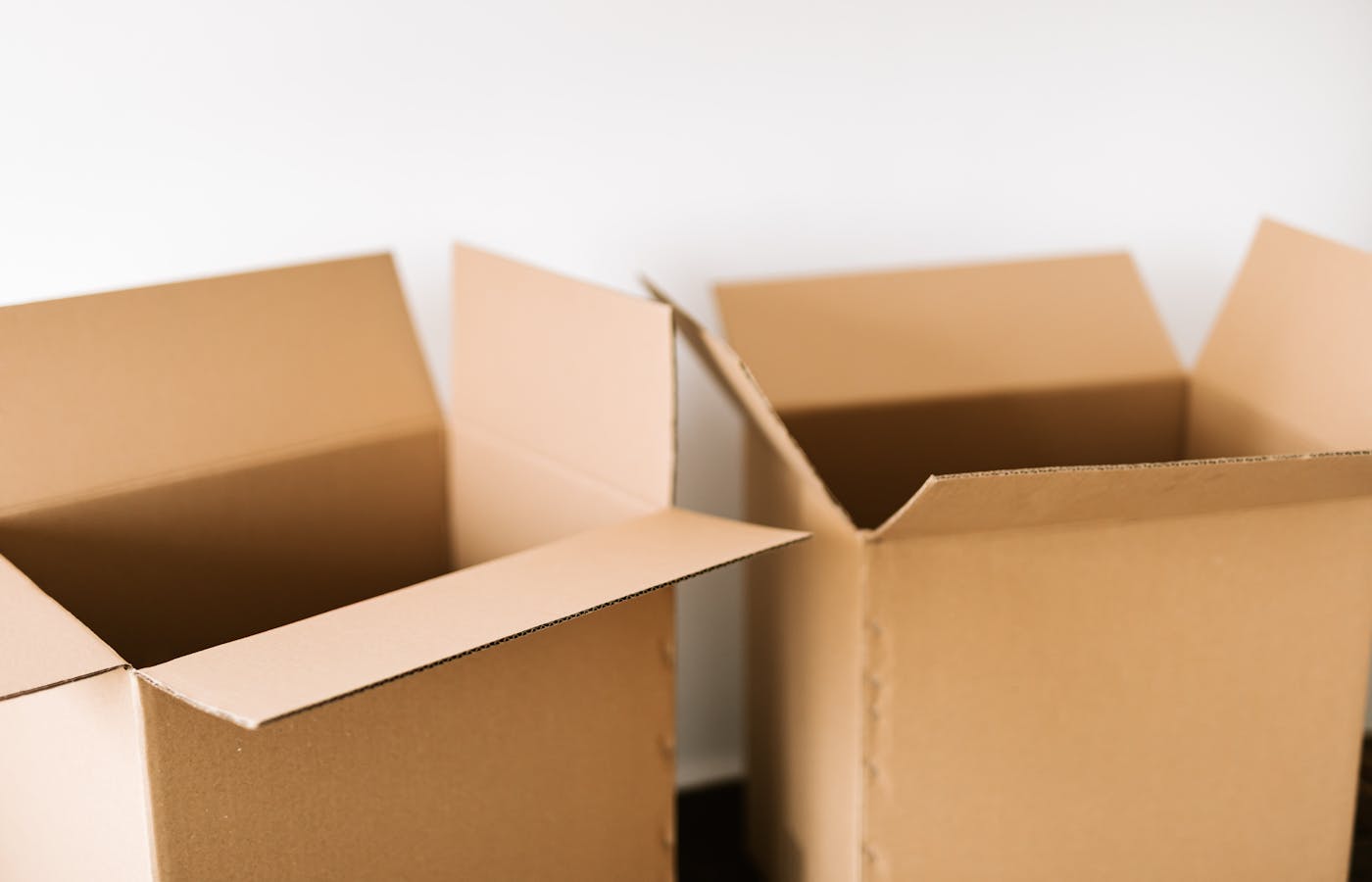 Open moving cardboard boxes on the floor