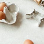 Baking supplies with eggs and metal cookie cutters