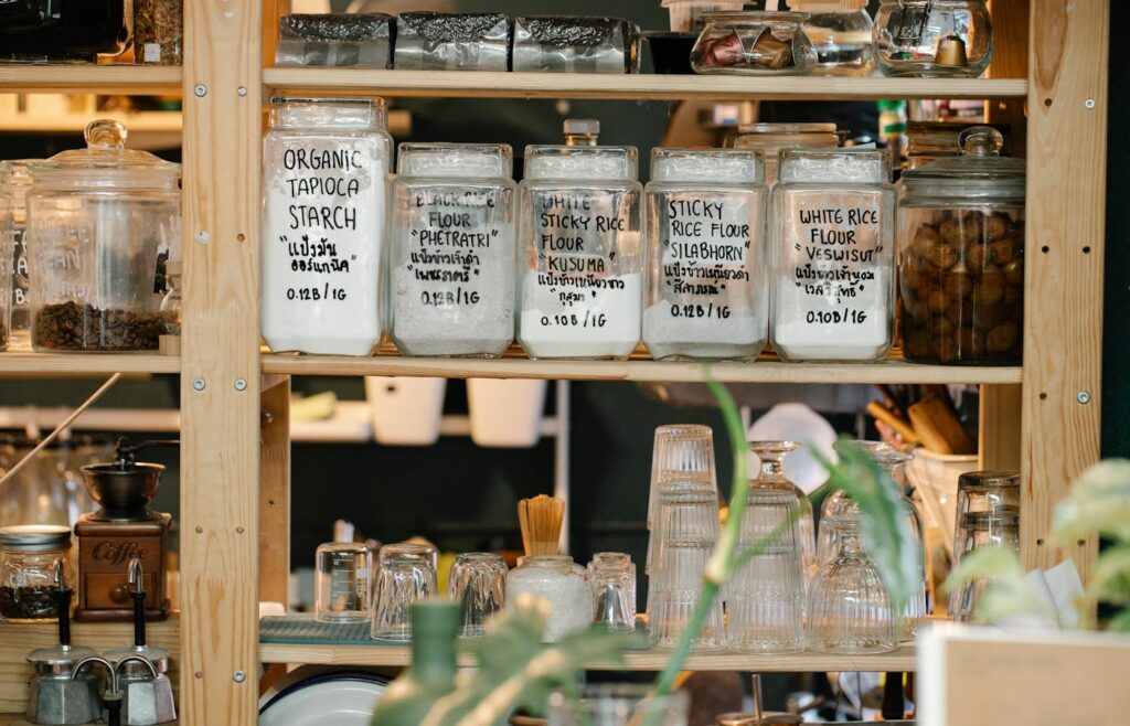 Baking flour jars and dry goods on wooden shelves