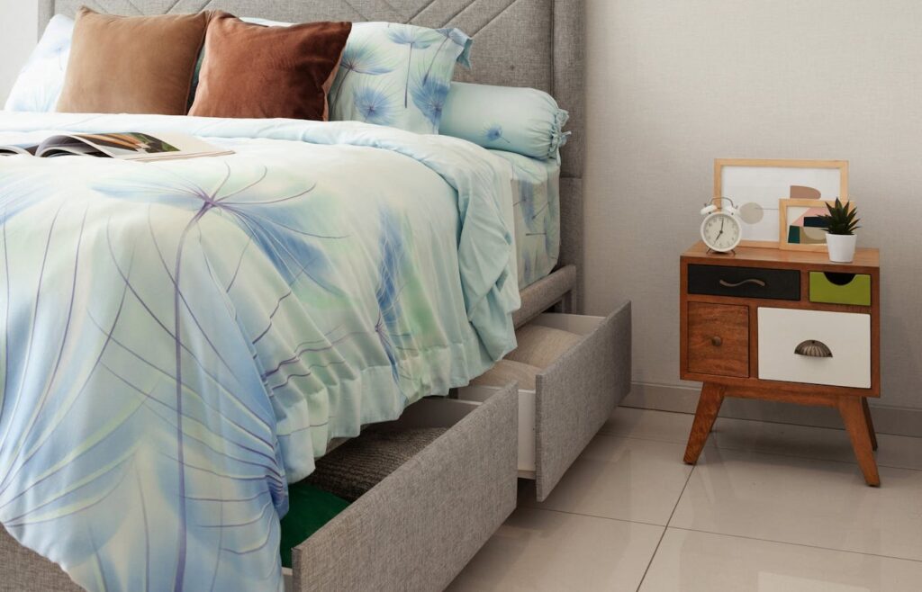 Bedroom bed with built-in storage drawers pulled open